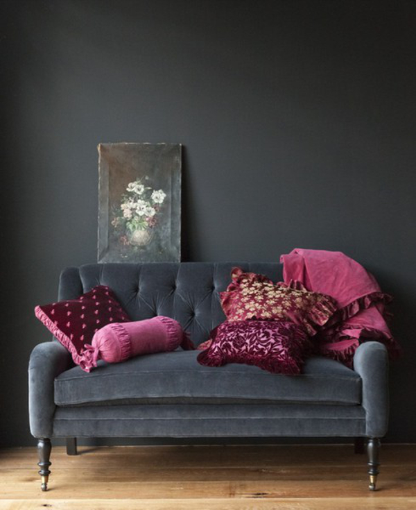 Charcoal grey living room with pink accent colour