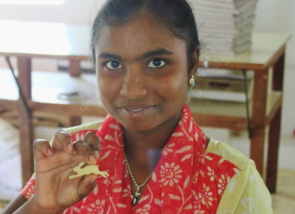 Fair trade jewellery being made for Decorator's Notebook